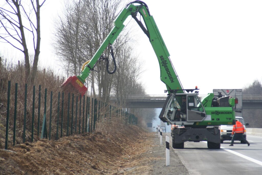 Fecon forestry mulching head on a Sennebogen excavator clearing brush