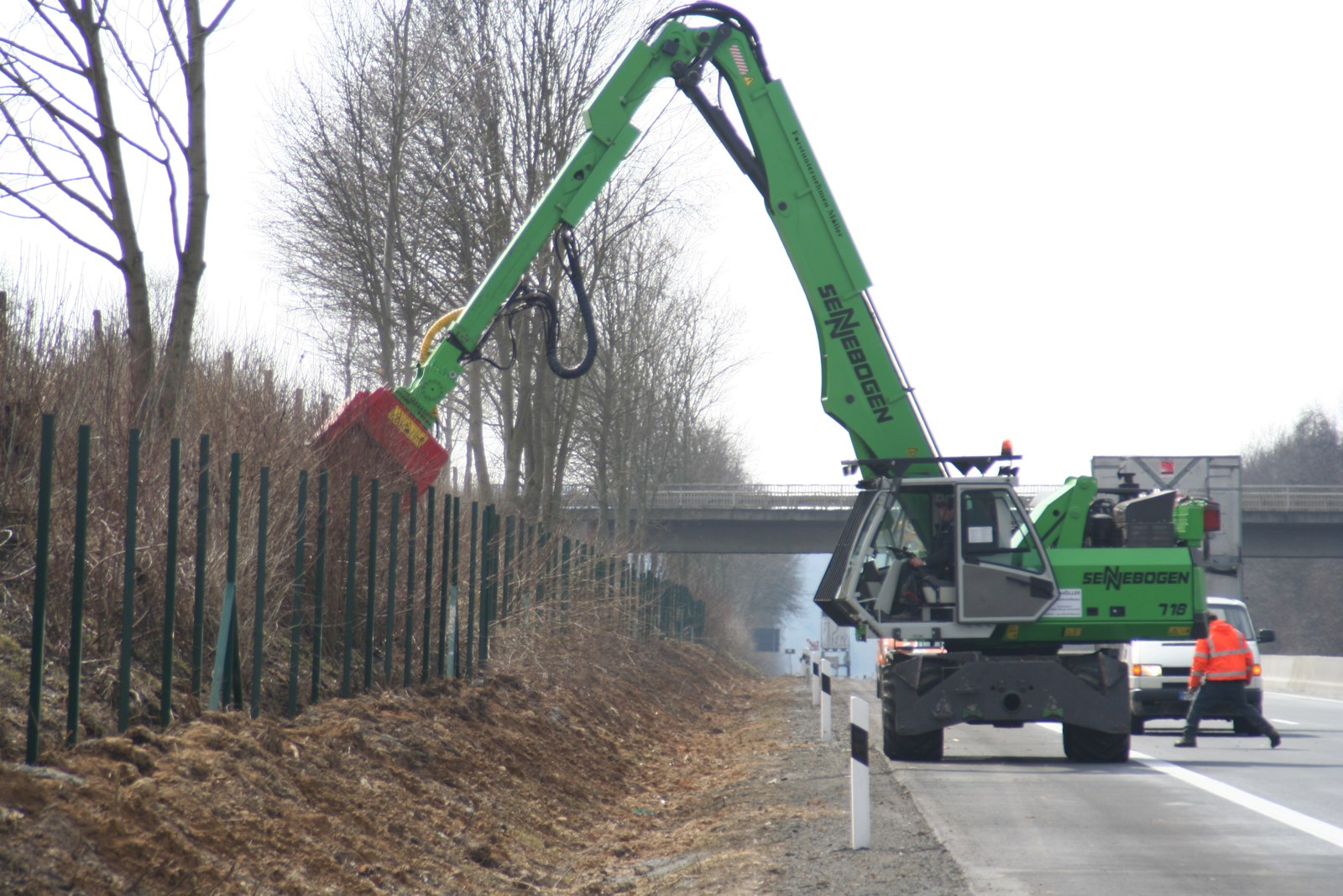 Fecon forestry mulching head on a Sennebogen excavator clearing brush